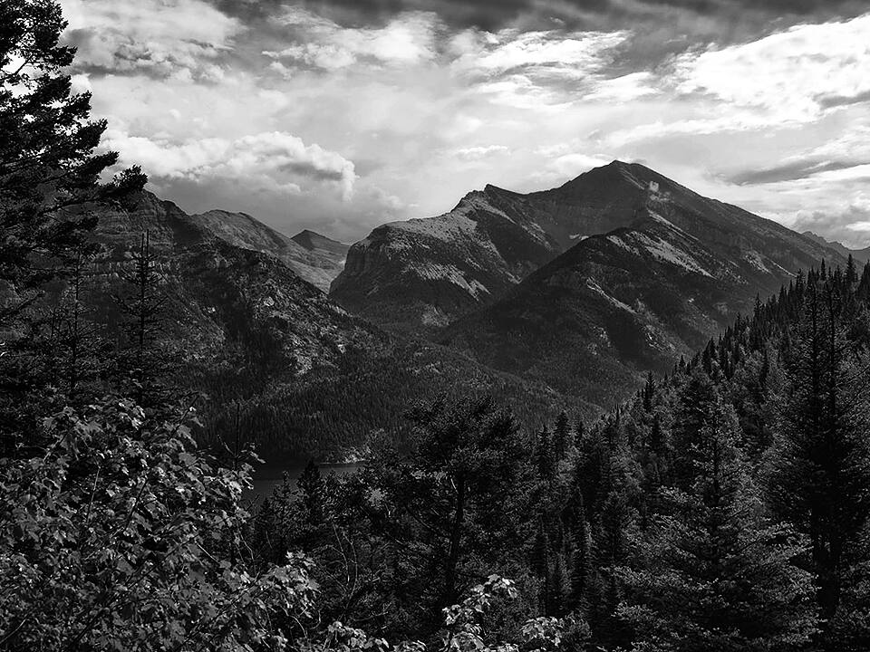 Black and white mountain valley landscape.